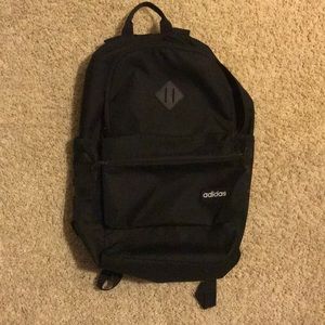 Adidas black stripe backpack.
